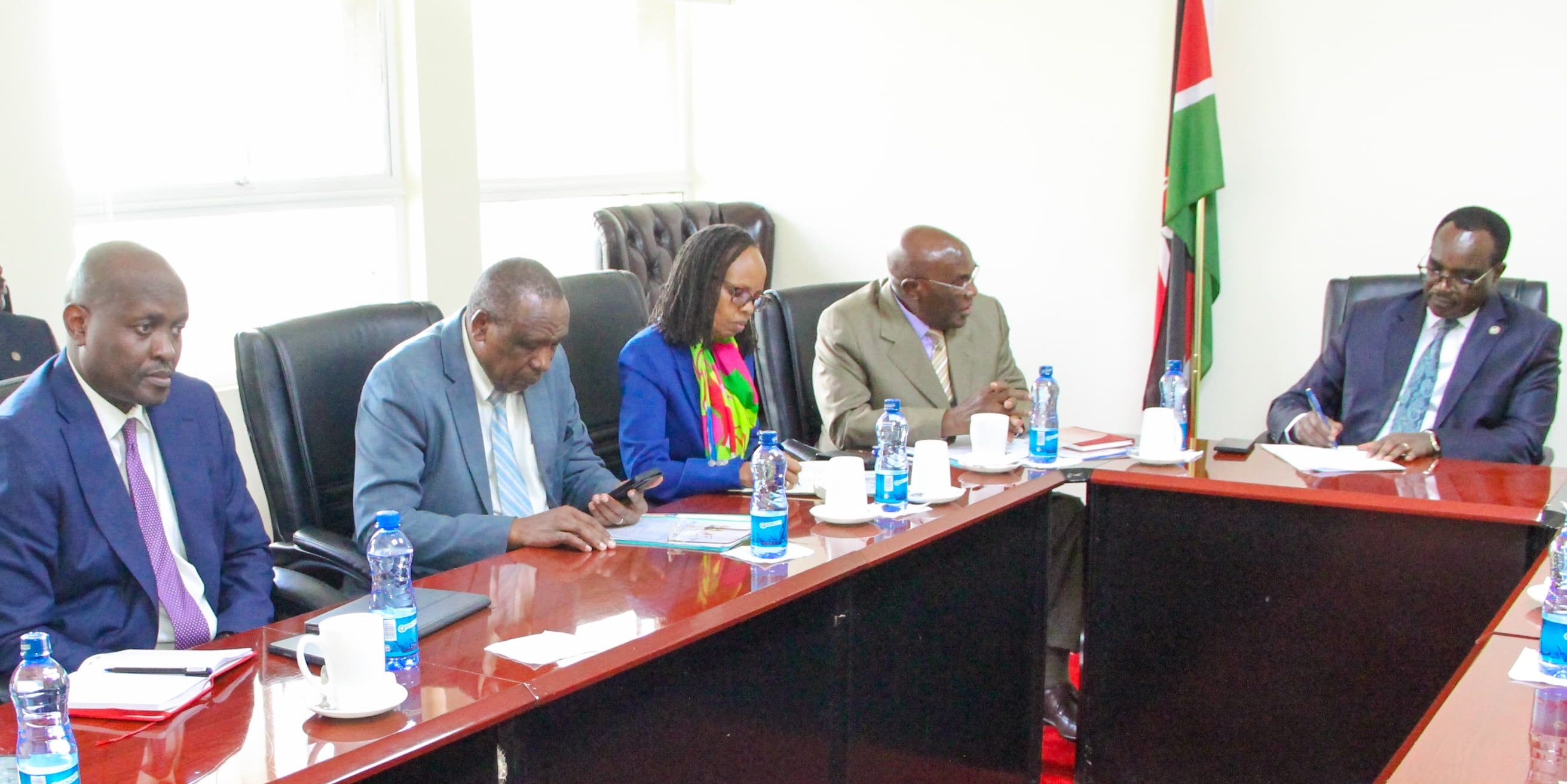 Education CS with KUCCPS Board Chair, CEO and other Board members