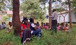 At Ngiluni Location Chief's Camp, Makueni County. Over 100 participants were present.