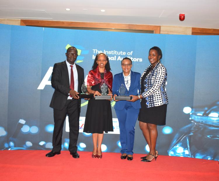 CEO group photo with trophies